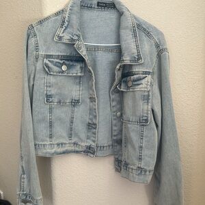Multiple denim jackets and sweater
